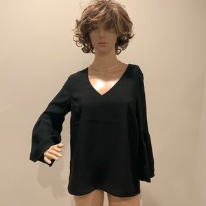 Classic black v neck blouse for day and casual wear that can also be dressed up